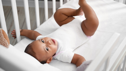 Cute little baby in crib