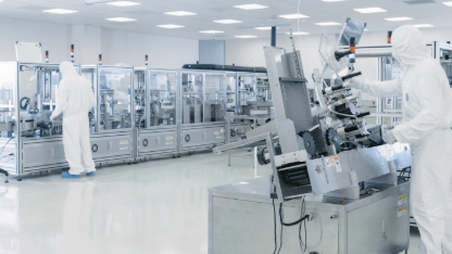 Automated pharmaceutical manufacturing line in a GMP cleanroom, illustrating sterile drug production, process control, and quality-focused manufacturing operations.