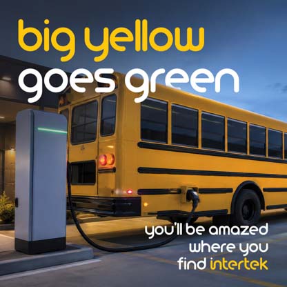 An electric school bus at a charging station